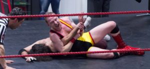 Wrestler performing an armbar