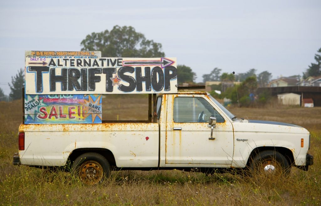 An old truck giving directions to a thrift shop - cheap copywriting