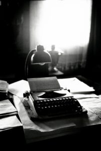Vintage typewriter and desk lamp illustrating freelance web content writing with craftmanship