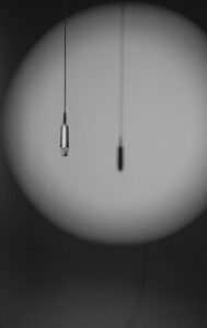 A picture of a microphone hanging down - find your voice with my website copywriting services
